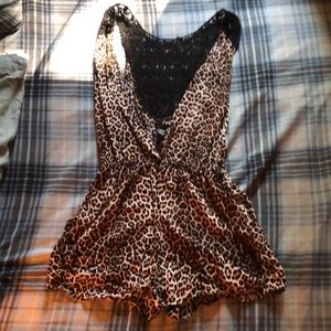 Cheetah romper, button up on the front.
